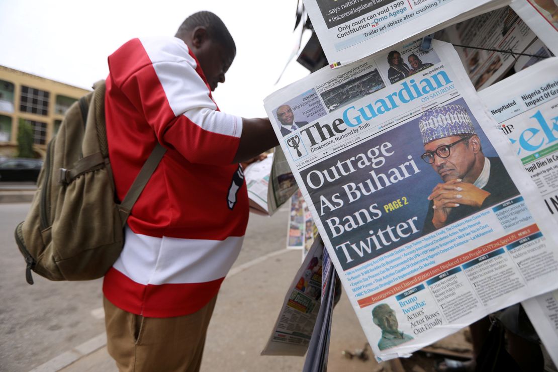 A man reads a newspaper at a newsstand in Abuja, Nigeria. REUTERS/Afolabi Sotunde