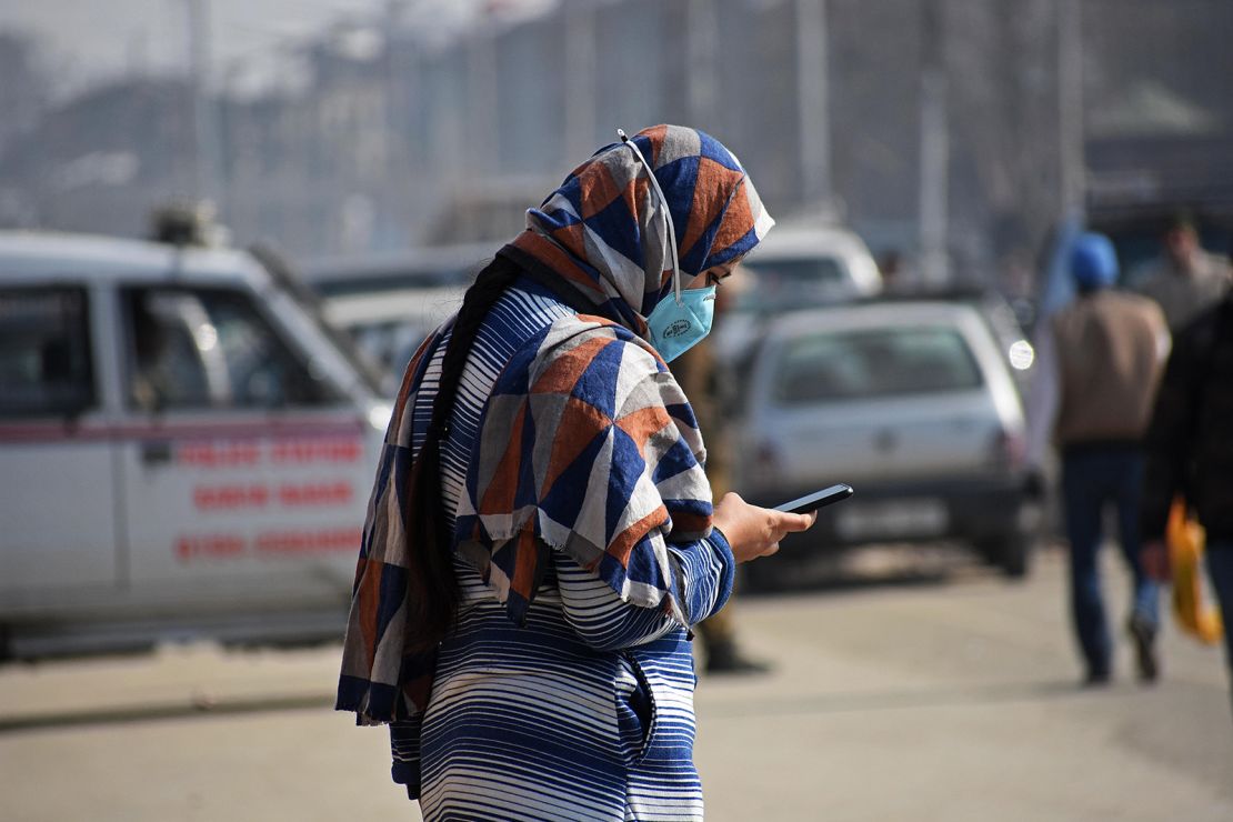 A woman using her cellphone in Srinagar, India. Photo by Faisal Khan/Anadolu Agency via Getty Images