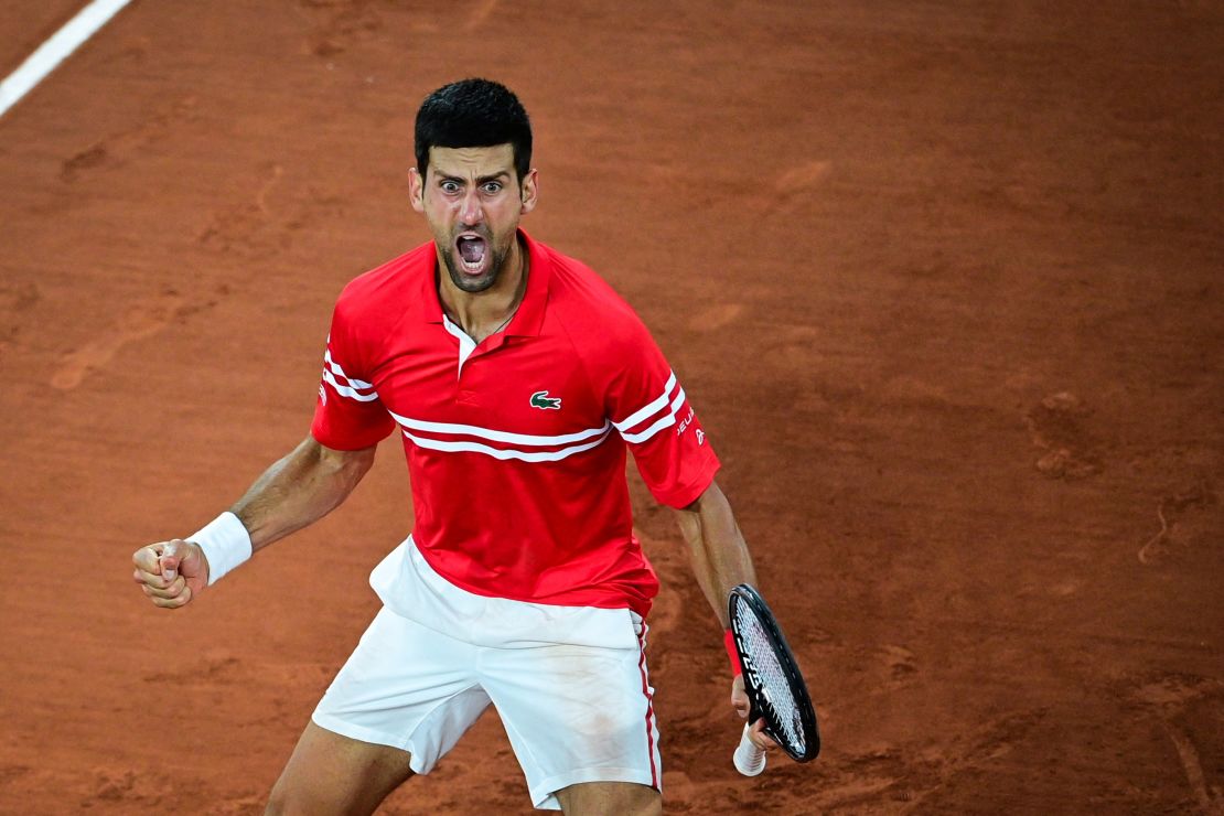 Novak Djokovic celebrates after winning against Italy's Matteo Berrettini at the French Open.