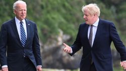 Britain's Prime Minister Boris Johnson (R) speaks with US President Joe Biden while they walk at Carbis Bay, Cornwall on June 10, 2021, ahead of the three-day G7 summit being held from 11-13 June. - G7 leaders from Canada, France, Germany, Italy, Japan, the UK and the United States meet this weekend for the first time in nearly two years, for the three-day talks in Carbis Bay, Cornwall. - (Photo by TOBY MELVILLE / POOL / AFP) (Photo by TOBY MELVILLE/POOL/AFP via Getty Images)
