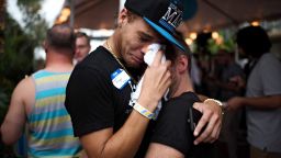 A pair embrace after exiting a gathering at Parliament House Resort in the wake of the mass shooting at the gay nightclub Pulse, in Orlando, Fla., June 12, 2016. (Hilary Swift/The New York Times)