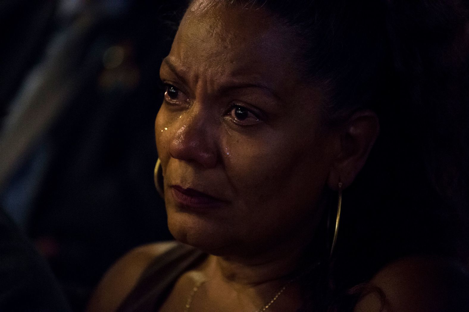 Orlando resident Jaqueline Perez sheds tears during a vigil at the Joy Metropolitan Community Church.
