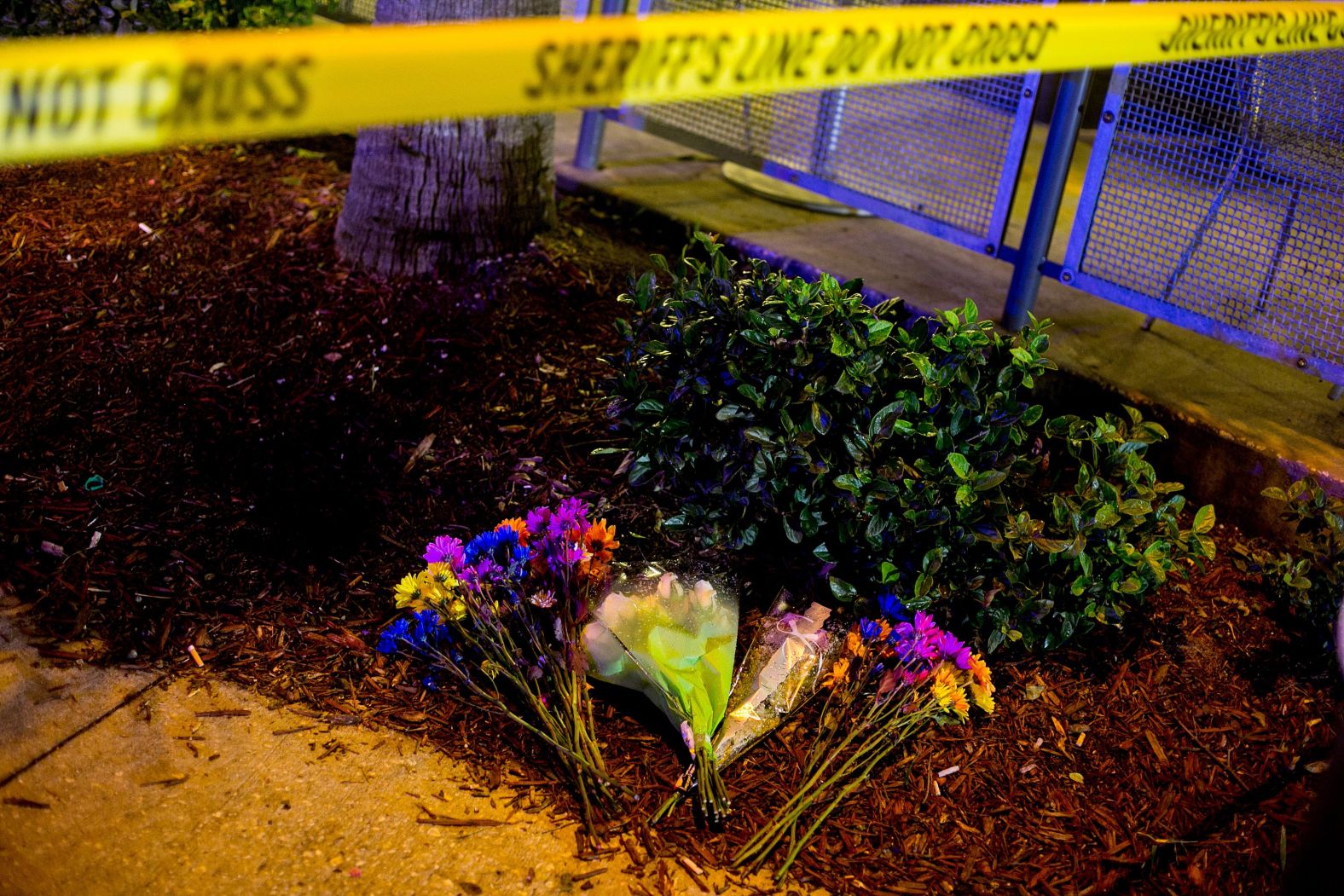Flowers and police tape are seen near the Pulse nightclub.