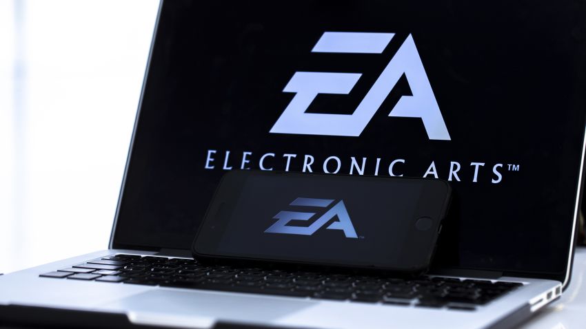 A photo shows the logo of 'Electronic Arts' video game company on a laptop screen.