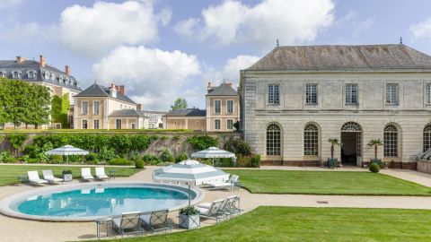 A swimming pool and acres of mazes, lakes and gardens are part of the allure at Hotel Château du Grand-Lucé.