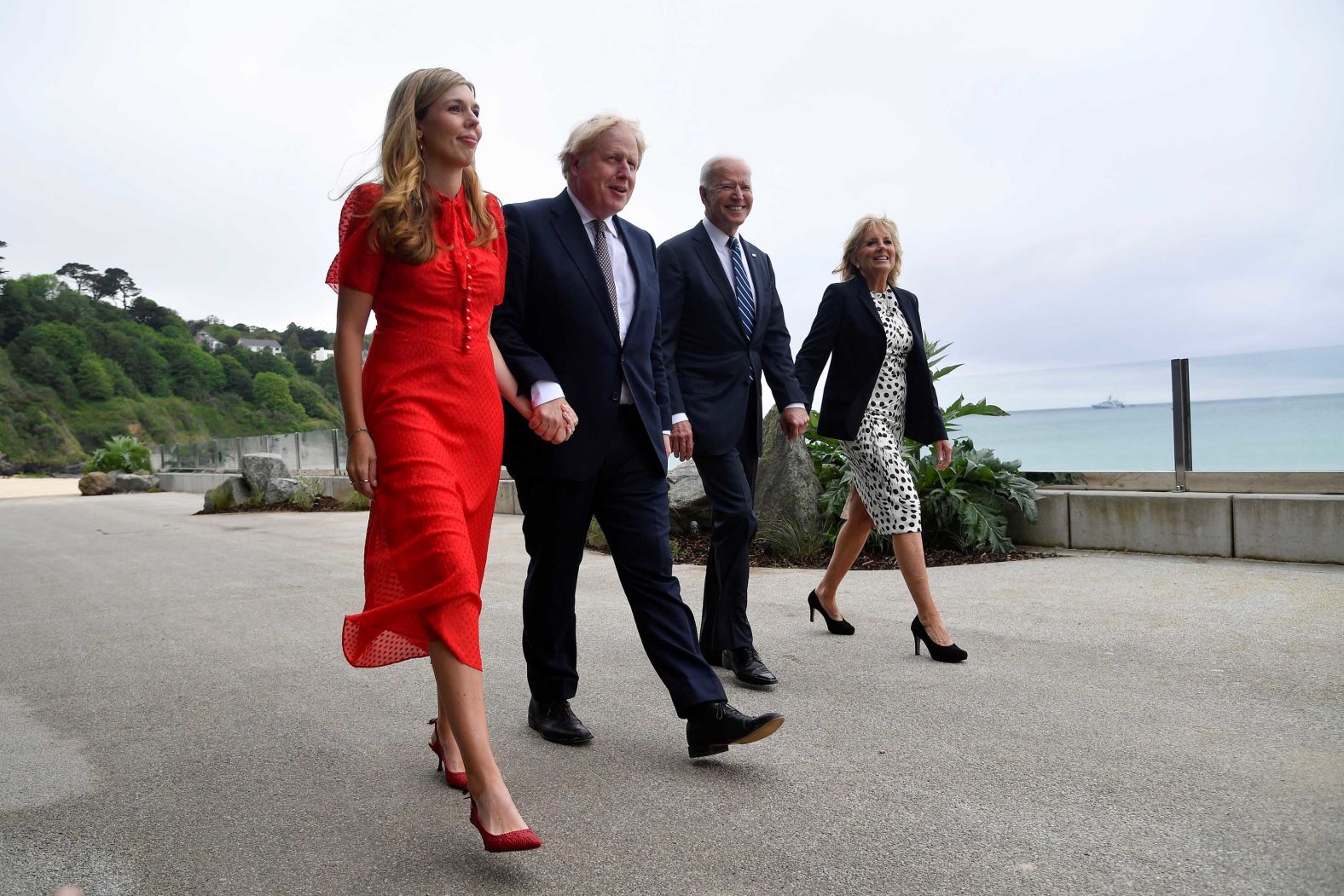 The Bidens walk with Johnson and his wife, Carrie, outside Carbis Bay on Thursday. The Johnsons <a href="index.php?page=&url=https%3A%2F%2Fwww.cnn.com%2F2021%2F05%2F29%2Fworld%2Fboris-johnson-marries-carrie-symonds-intl%2Findex.html" target="_blank">were married last month.</a>