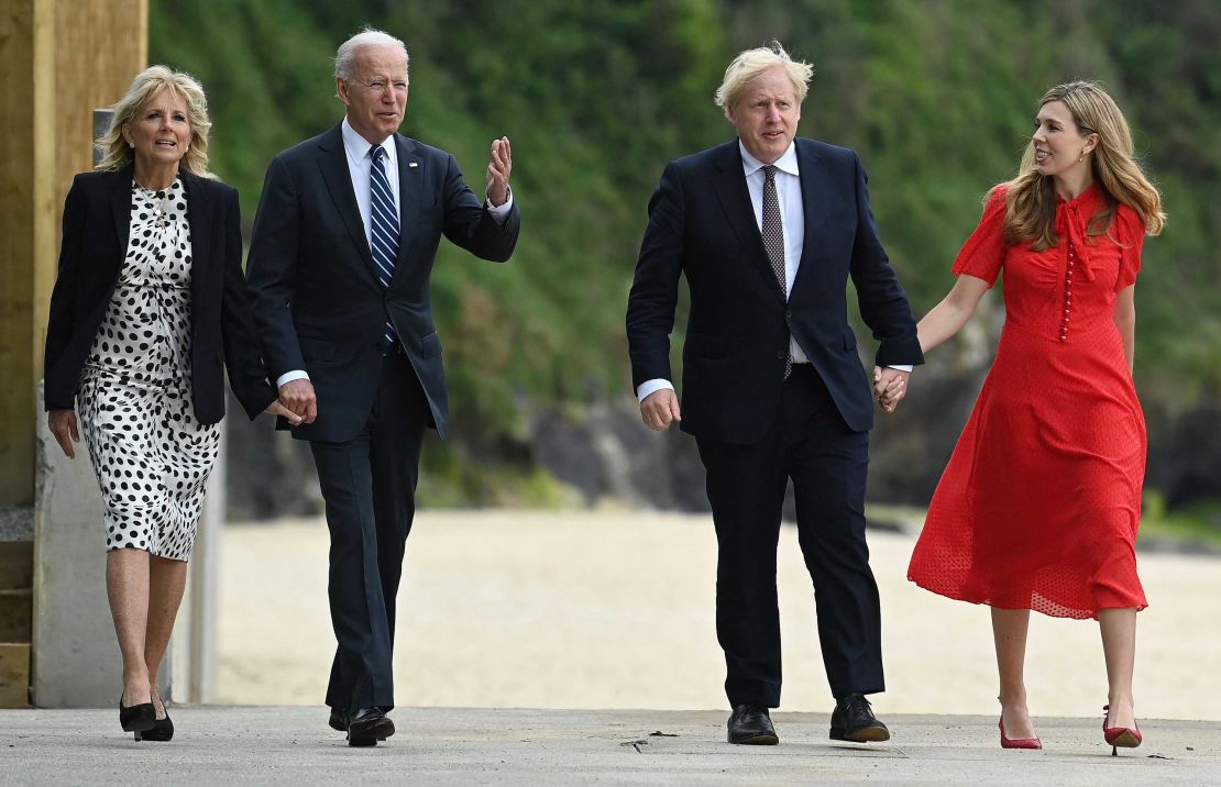 Britain's Prime Minister Boris Johnson and his wife Carrie Johnson walk with US President Joe Biden and US First Lady Jill Biden at Carbis Bay, Cornwall on June 10, 2021, ahead of the three-day G7 summit.