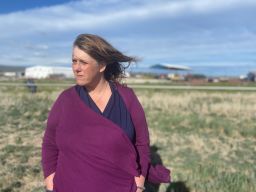 Fourth-generation farmer Tricia Hill stands in an open field at her family farm. She was only able to plant in other fields that don't rely on the Klamath Project for water by using well water.