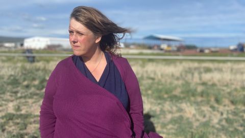 Fourth-generation farmer Tricia Hill stands in an open field at her family farm. She was only able to plant in other fields that don't rely on the Klamath Project for water by using well water.
