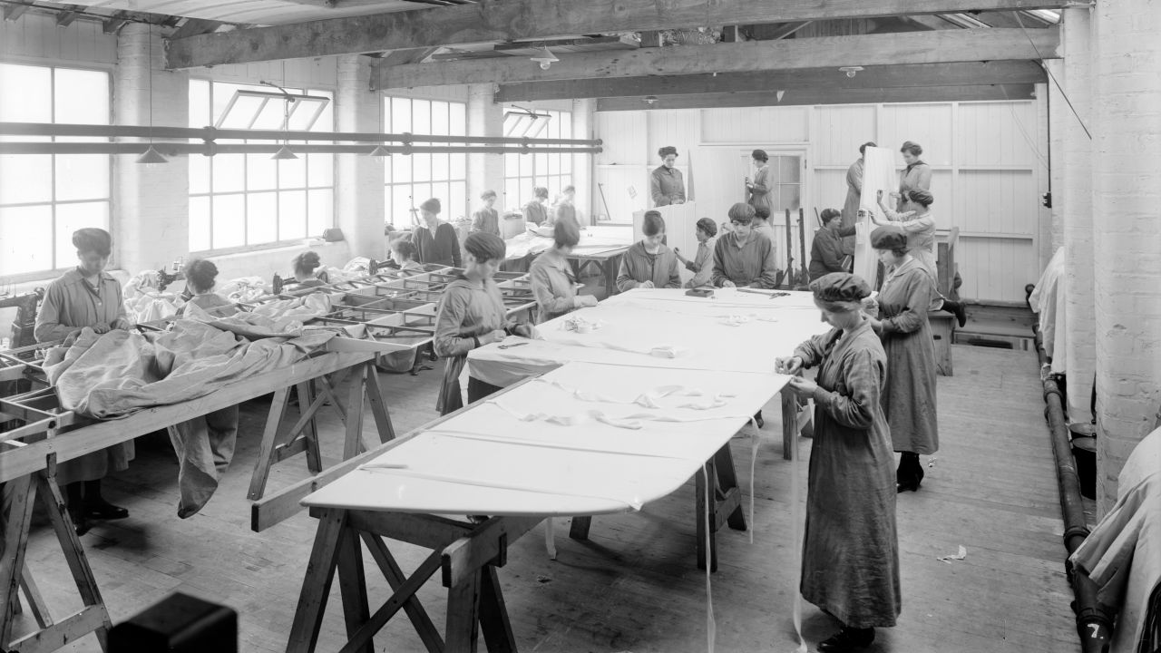 Although World War I made employers reconsider the jobs given to women, women often remained in traditionally feminine roles, like these women sewing fabric onto aircraft wings at an English factory in 1918. Elsewhere in this factory, however, women were beginning to work alongside men in jobs such as carpentry. 