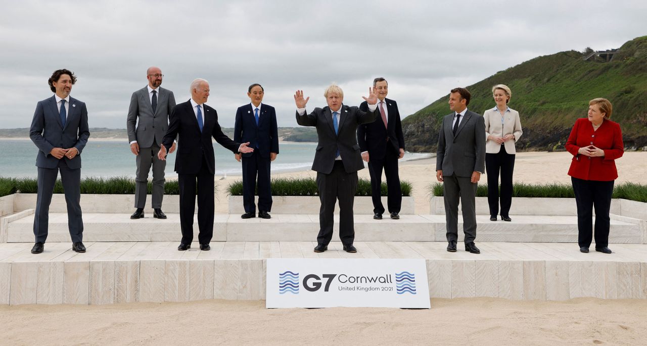 Biden and other leaders pose for a group photo at the G7 summit.