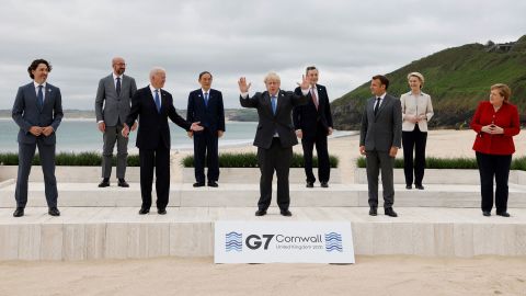 Biden and other leaders pose for a group photo at the G7 summit.