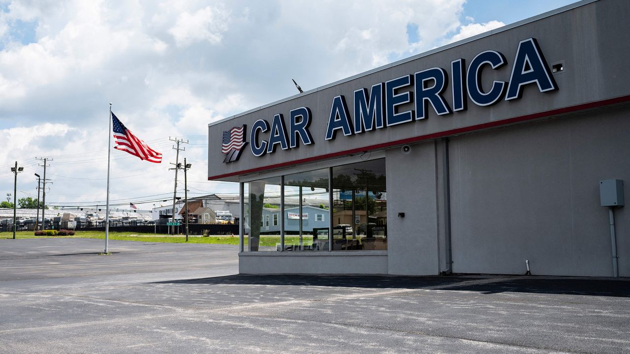 A car dealership stands empty in Laurel, Maryland.
