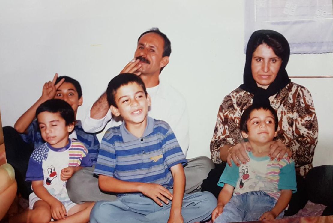 Navid Afkari (bottom left), sitting with his brother Vahid (top left), brother Saeid (bottom center), Habib (bottom right) father (top center) and mother (top right). 