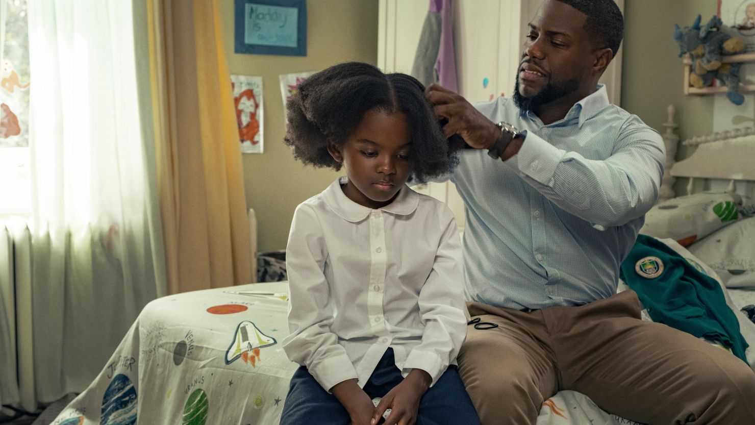 (From left) Melody Hurd as Maddy and Kevin Hart as Matt star in "Fatherhood." 