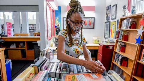Librarian Sharice Towles at the Reading Public Library Main Branch in Reading, Pennsylvania, where officials have stopped charging fines on most library items because of the pandemic. 
