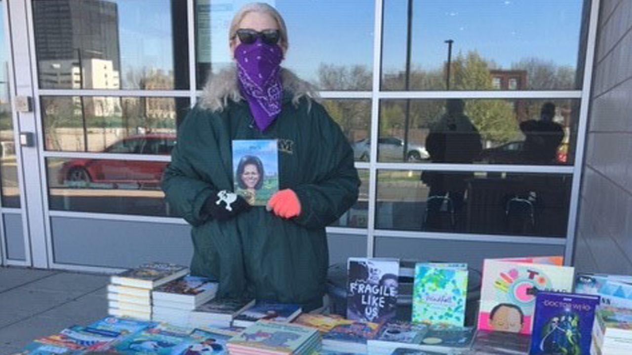Denise Martens, the assistant director of Youth and Family Services at Hartford Public Library, standing in front of the library's main branch in downtown Hartford, during the pandemic when most public libraries in America closed their doors.