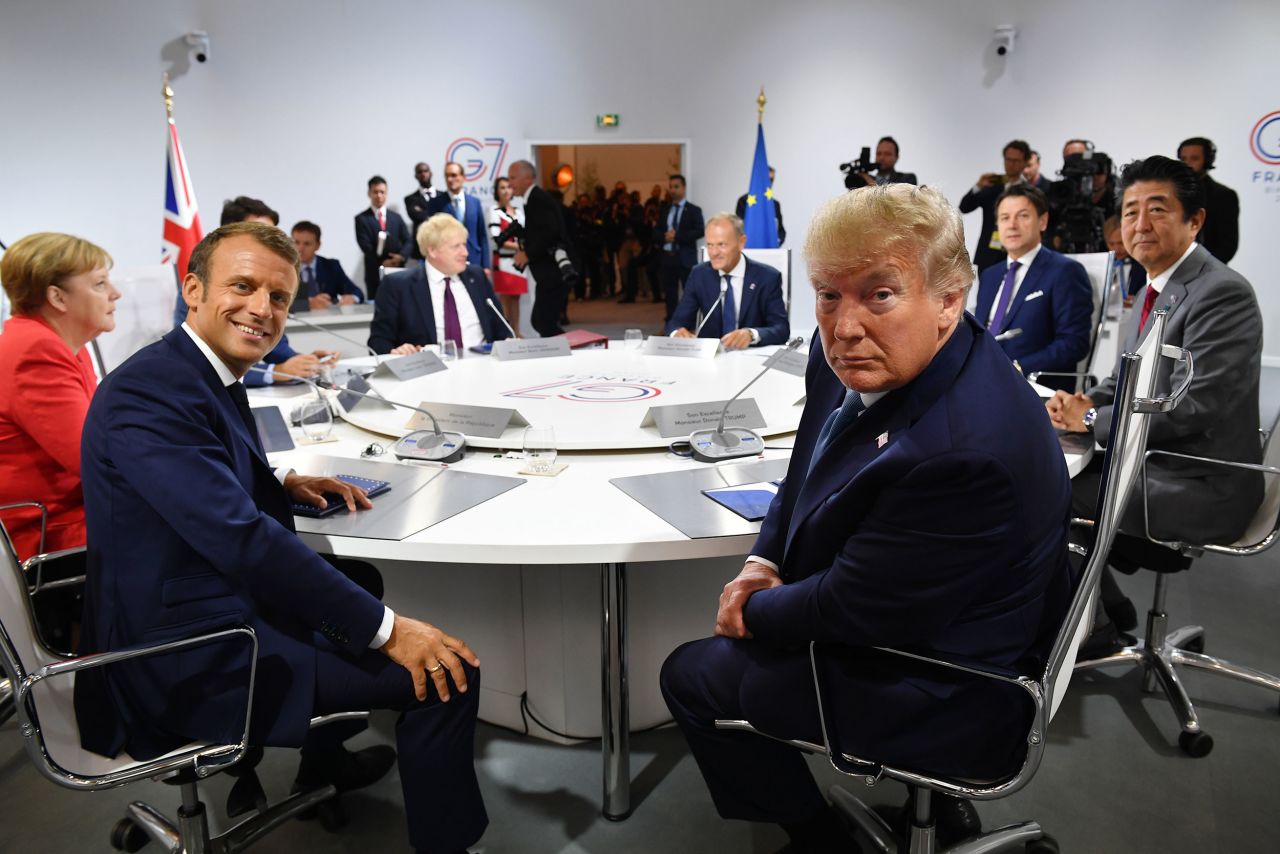 French President Macron and US President Trump pose for a photo before the first working session of the 45th G7 summit in Biarritz, France, in 2019.