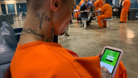 North Fork Correctional Center inmate Byron Robinson with his new computer tablet.