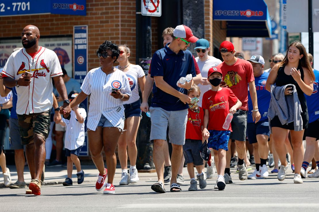 Fans make their way towards Chicago's Wrigley Field on Friday, as the city announced Covid-19 restrictions were lifted.