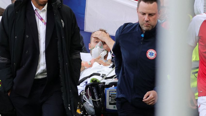 TOPSHOT - Denmark's midfielder Christian Eriksen (C) is evacuated after collapsing on the pitch during the UEFA EURO 2020 Group B football match between Denmark and Finland at the Parken Stadium in Copenhagen on June 12, 2021. (Photo by Friedemann Vogel / various sources / AFP) (Photo by FRIEDEMANN VOGEL/AFP via Getty Images)