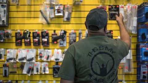 A customer reaches for a gun grip at ABQ Guns in Albuquerque, New Mexico, in September 2016.