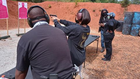 Members of the National African American Gun Association work on their aim at a shooting range in this undated photo.
