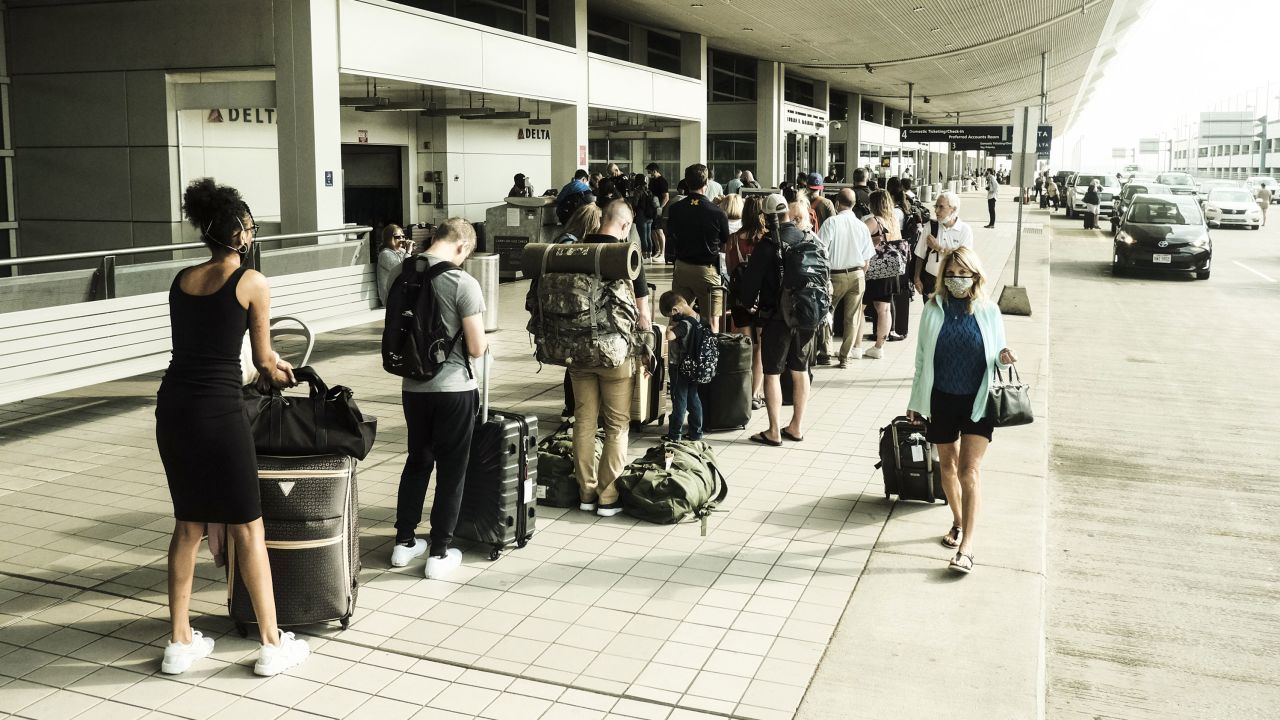 Travelers arrive at the Detroit Metropolitan Wayne County Airport (DTX) in Romulus, Michigan, on Saturday, June 12, 2021. 