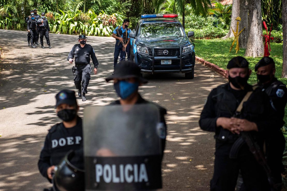 Riot police stand guard outside the house of pre-presidential candidate Cristiana Chamorro in Managua on June 2.