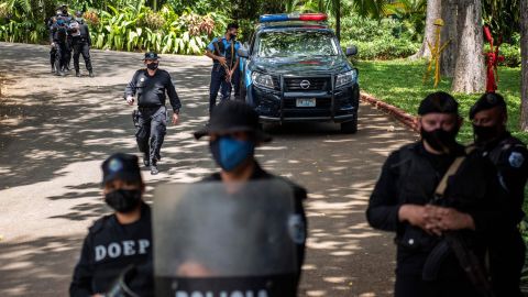 Riot police stand guard outside the house of pre-presidential candidate Cristiana Chamorro in Managua on June 2.