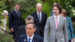 US President Joe Biden (C) and G7 leaders arrive for a family phtotograph during a reception at The Eden Project in south west England on June 11, 2021. - G7 leaders from Canada, France, Germany, Italy, Japan, the UK and the United States meet this weekend for the first time in nearly two years, for three-day talks in Carbis Bay, Cornwall. (Photo by Jack Hill / POOL / AFP) (Photo by JACK HILL/POOL/AFP via Getty Images)