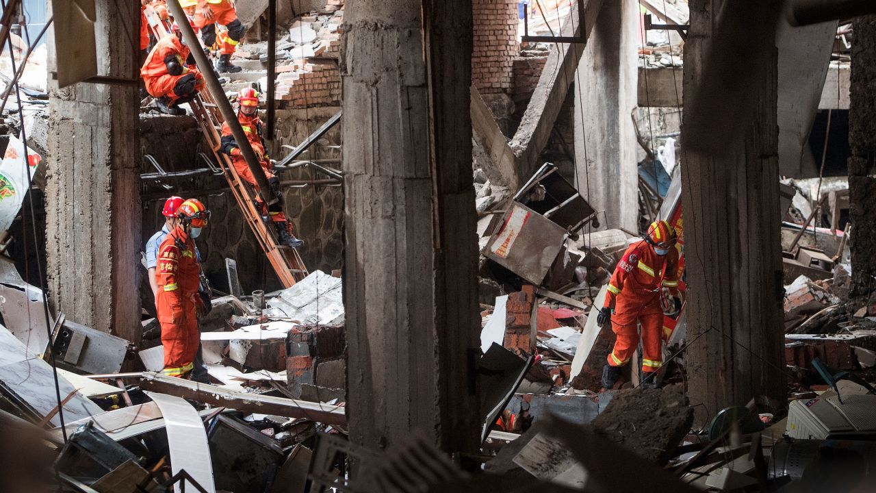 Rescue workers search for survivors in the aftermath of a gas explosion in Shiyan city in central China's Hubei Province on Sunday.