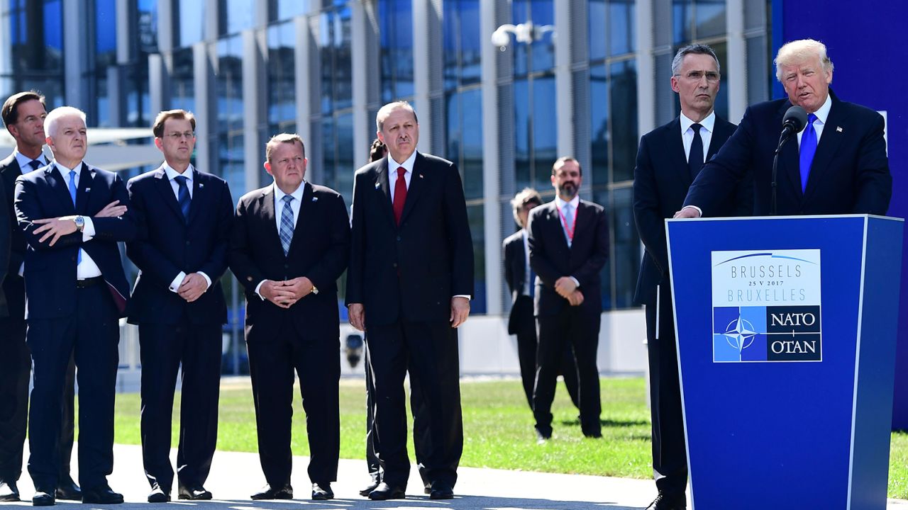 From left: Dutch Prime Minister Mark Rutte, Montenegro's Prime Minister Dusko Markovic, Slovenian Prime Minister Miro Cerar, Danish Prime Minister Lars Lokke Rasmussen, Turkish President Recep Tayyip Erdogan, and NATO Secretary General Jens Stoltenberg listen to US President Donald Trump's speech during the unveiling ceremony of the Berlin Wall monument, during the NATO summit in Brussels on May 25, 2017.