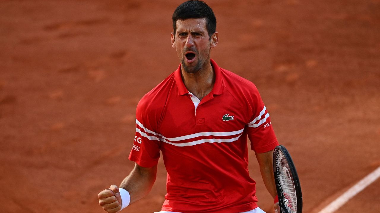 Novak Djokovic celebrates after beating Stefanos Tsitsipas in the French Open final.