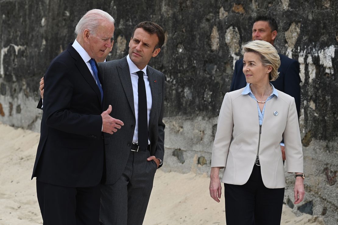 US President Joe Biden, President of France, Emmanuel Macron and European Commission Ursula von der Leyen speak after posing for photos during the Leaders official welcome and family photo during the G7 Summit In Carbis Bay, on June 11, 2021 in Carbis Bay, Cornwall.