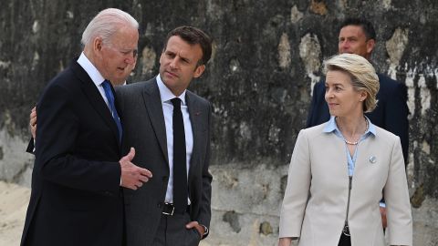 US President Joe Biden, President of France, Emmanuel Macron and European Commission Ursula von der Leyen speak after posing for photos during the Leaders official welcome and family photo during the G7 Summit In Carbis Bay, on June 11, 2021 in Carbis Bay, Cornwall.