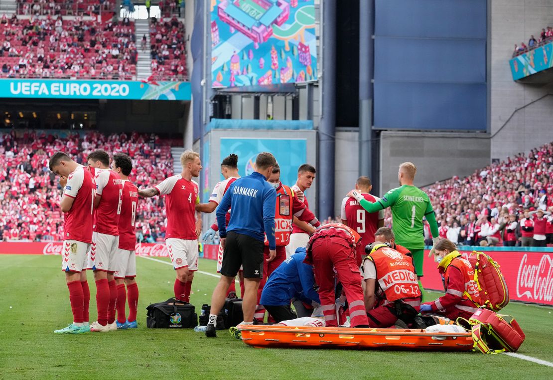 Eriksen receives treatment during Saturday's game.