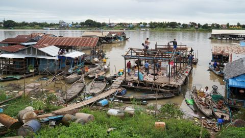 Residents demolish their floating houses on the Tonle Sap river after they were ordered to leave within one week of being notified by local authorities in Prek Pnov district, Phnom Penh, Cambodia, June 12, 2021. REUTERS/Cindy Liu