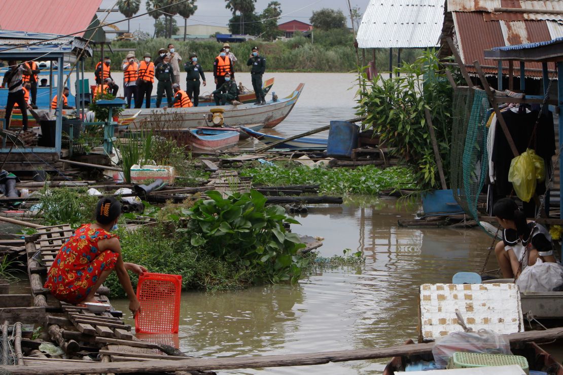 Local authorities order villagers to dismantle their floating houses along the Tonle Sap river bank, near the village of Prek Pnov in Phnom Penh, Cambodia, on June 12.