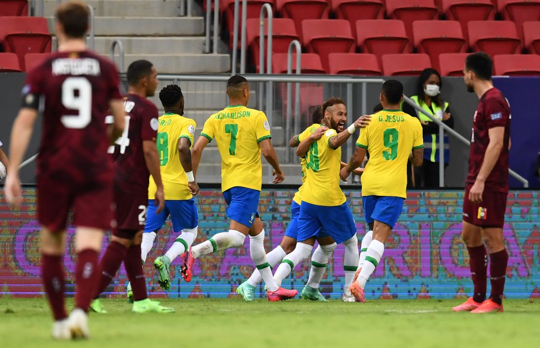 Neymar celebrates with teammates after scoring against Venezuela.