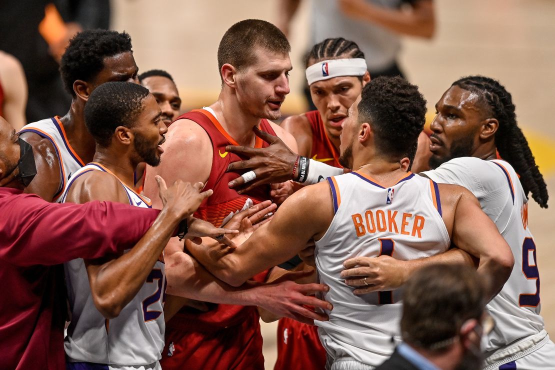 Jokic and Booker exchange words after a play that would result in Jokic being ejected.