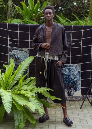 Lagos Space Programme applies adire, a traditional Yoruba indigo resist-dyeing practice, to contemporary knitwear pieces. Thompson calls this method "post adire."