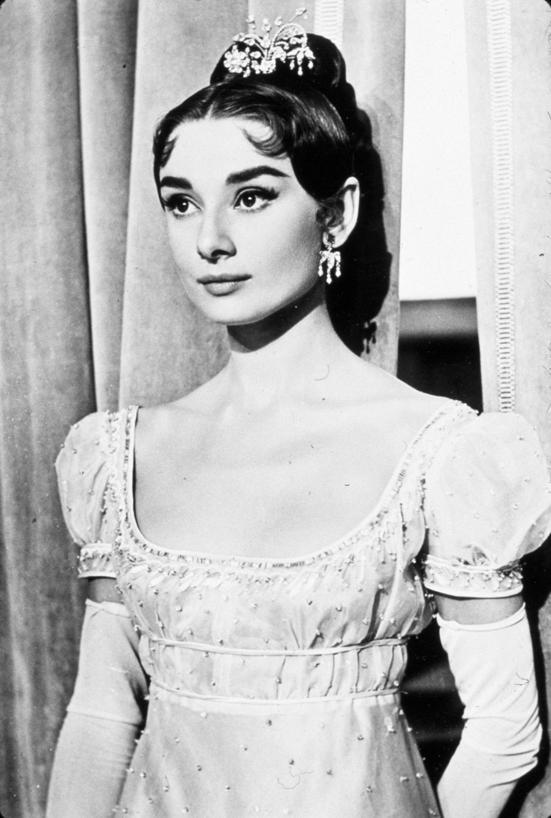 Audrey Hepburn wears an empire line dress designed by Fernanda Gattinoni for the 1956 film "War and Peace."