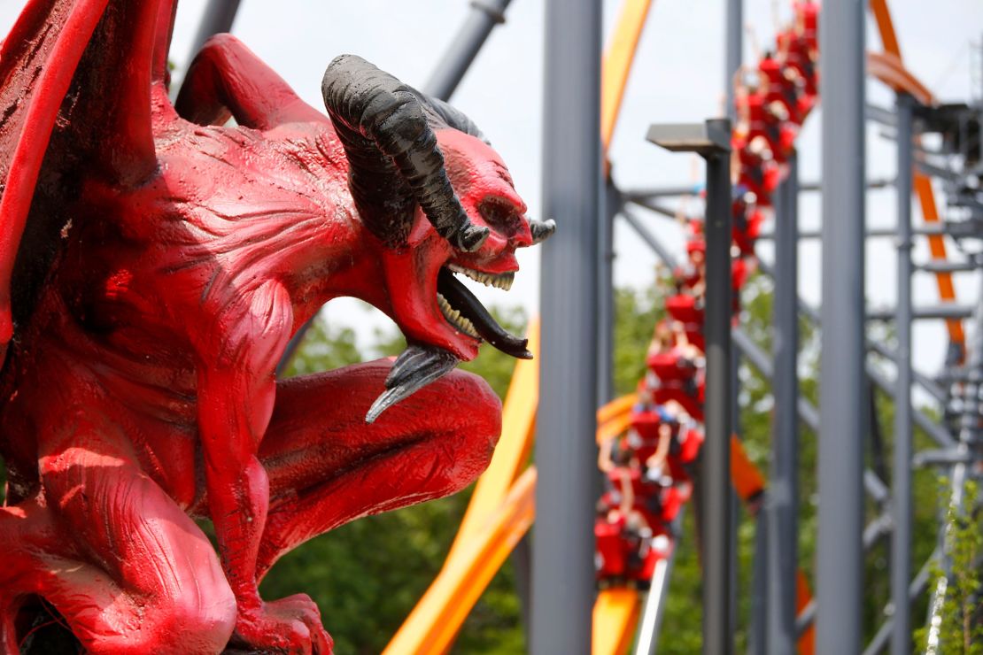 Riders get their thrill on the Jersey Devil Coaster at Six Flags Great Adventure on a June 10, 2021, preview day. The coaster features a single-rail, I-beam track. 
