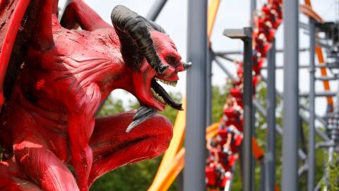 Riders get their thrill on the Jersey Devil Coaster at Six Flags Great Adventure on a June 10, 2021, preview day. The coaster features a single-rail, I-beam track. 