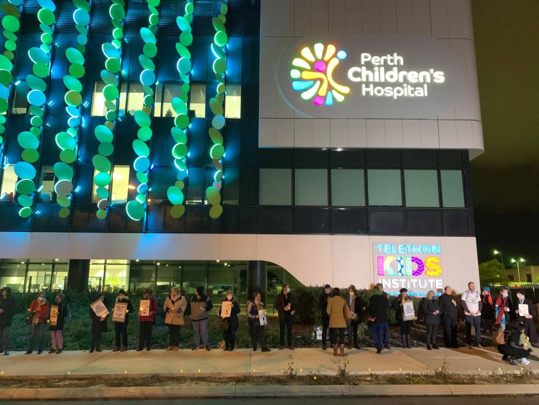 Supporters hold a vigil outside Perth Children's Hospital, where Tharnicaa is receiving medical care.