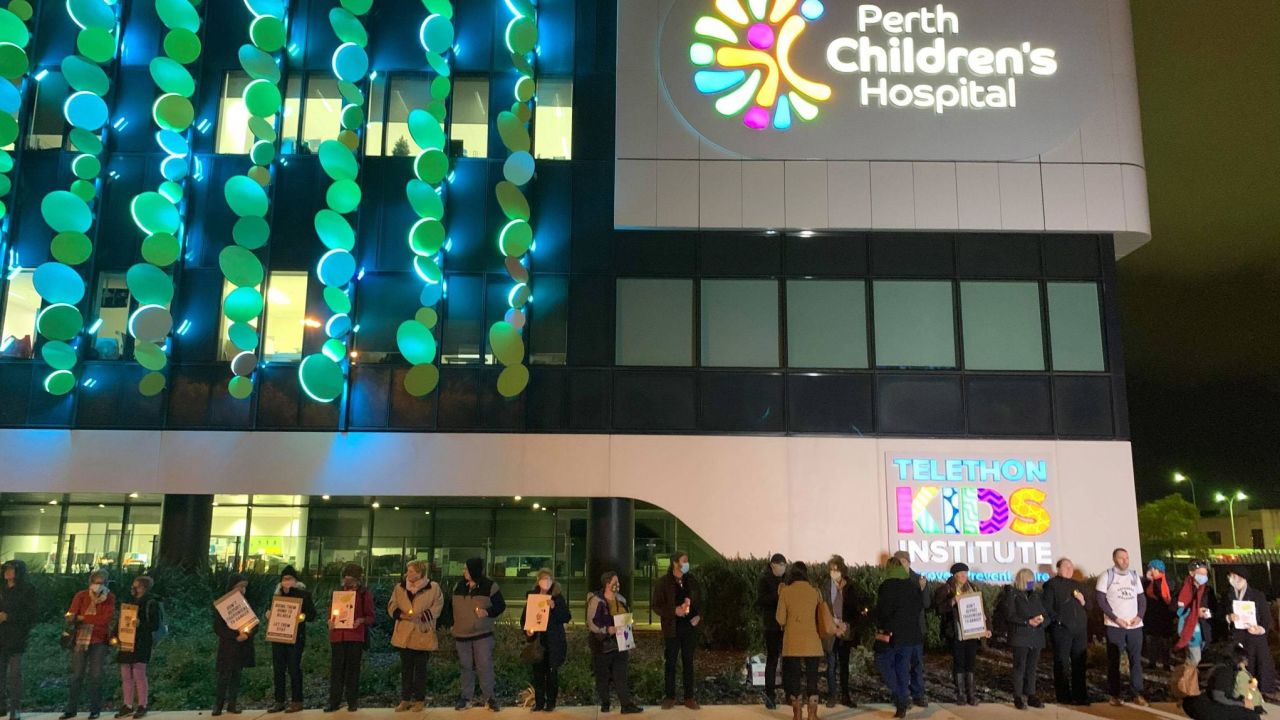 Supporters hold a vigil outside Perth Children's Hospital, where Tharnicaa is receiving medical care.