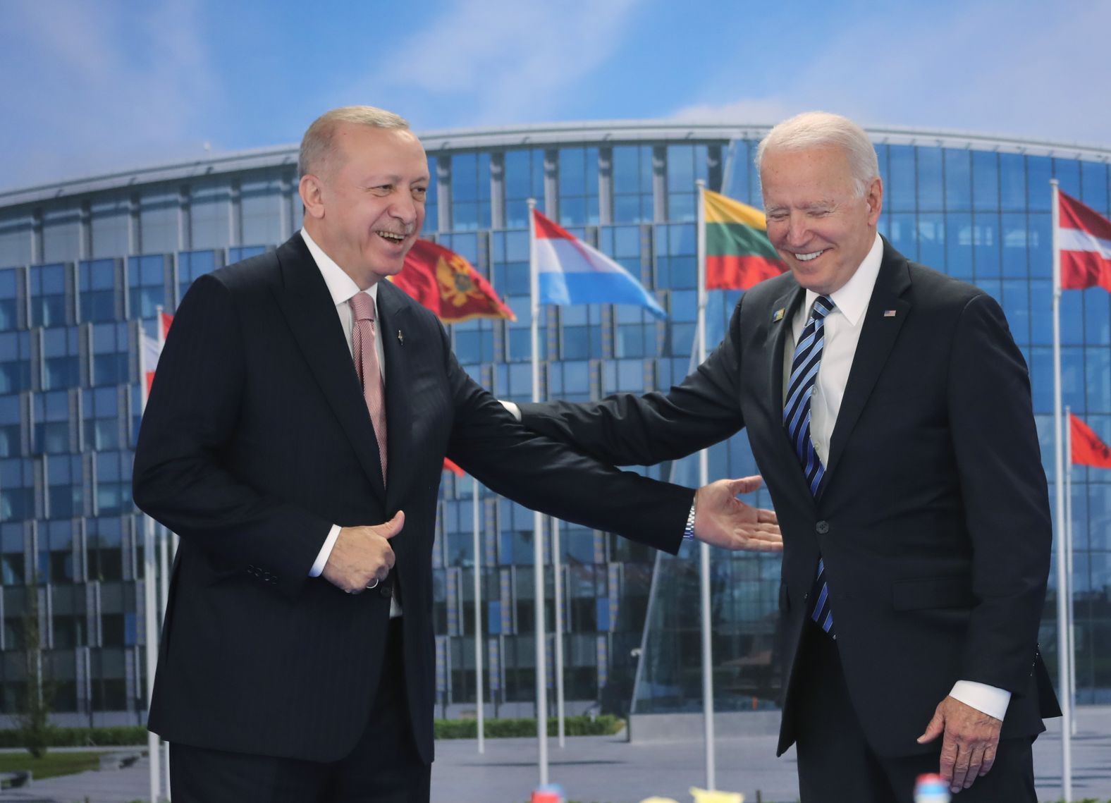 Turkish President Recep Tayyip Erdogan, left, greets Biden at the NATO summit in Brussels, Belgium, on Monday. Biden told reporters that much of <a href="index.php?page=&url=https%3A%2F%2Fwww.cnn.com%2F2021%2F06%2F14%2Fpolitics%2Frecep-tayyip-erdogan-joe-biden-bilateral%2Findex.html" target="_blank">his meeting with Erdogan</a> was one-on-one, and he said the interactions were "positive and productive."