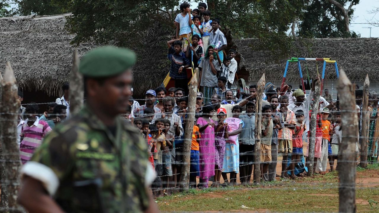 Displaced Tamil civilians during a visit by the then French and British Foreign Ministers at Kadirgamh camp in Chettikulam, northern Sri Lanka, April 2009. 
