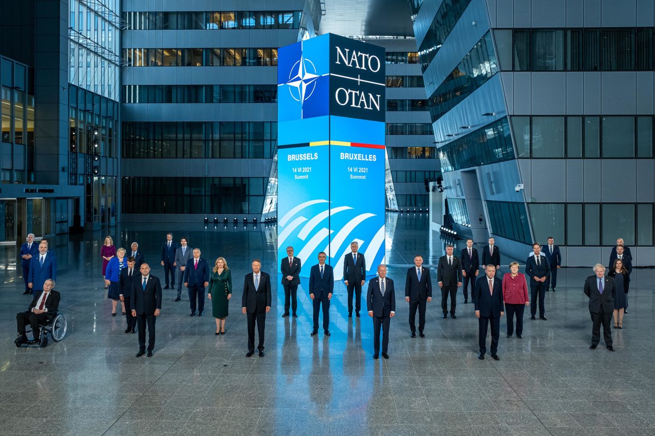 Biden and other world leaders pose for a group photo at the NATO summit.